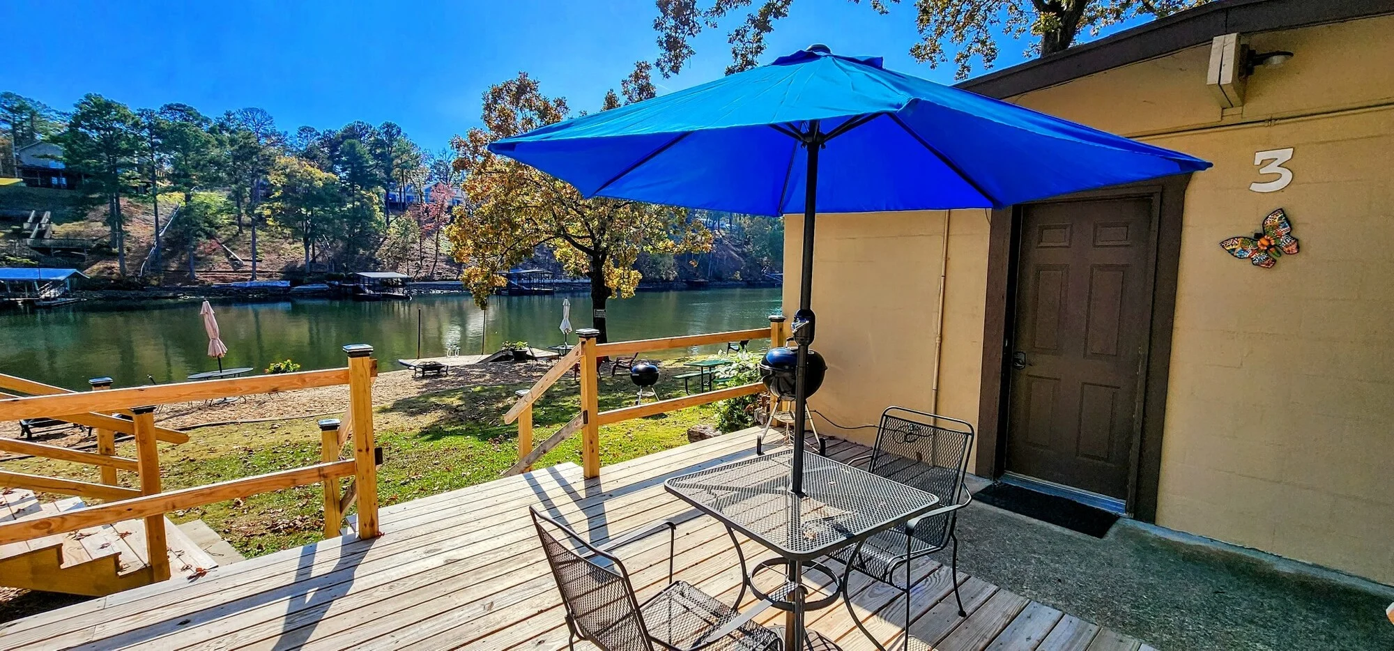 Cabin with a blue outdoor umbrella